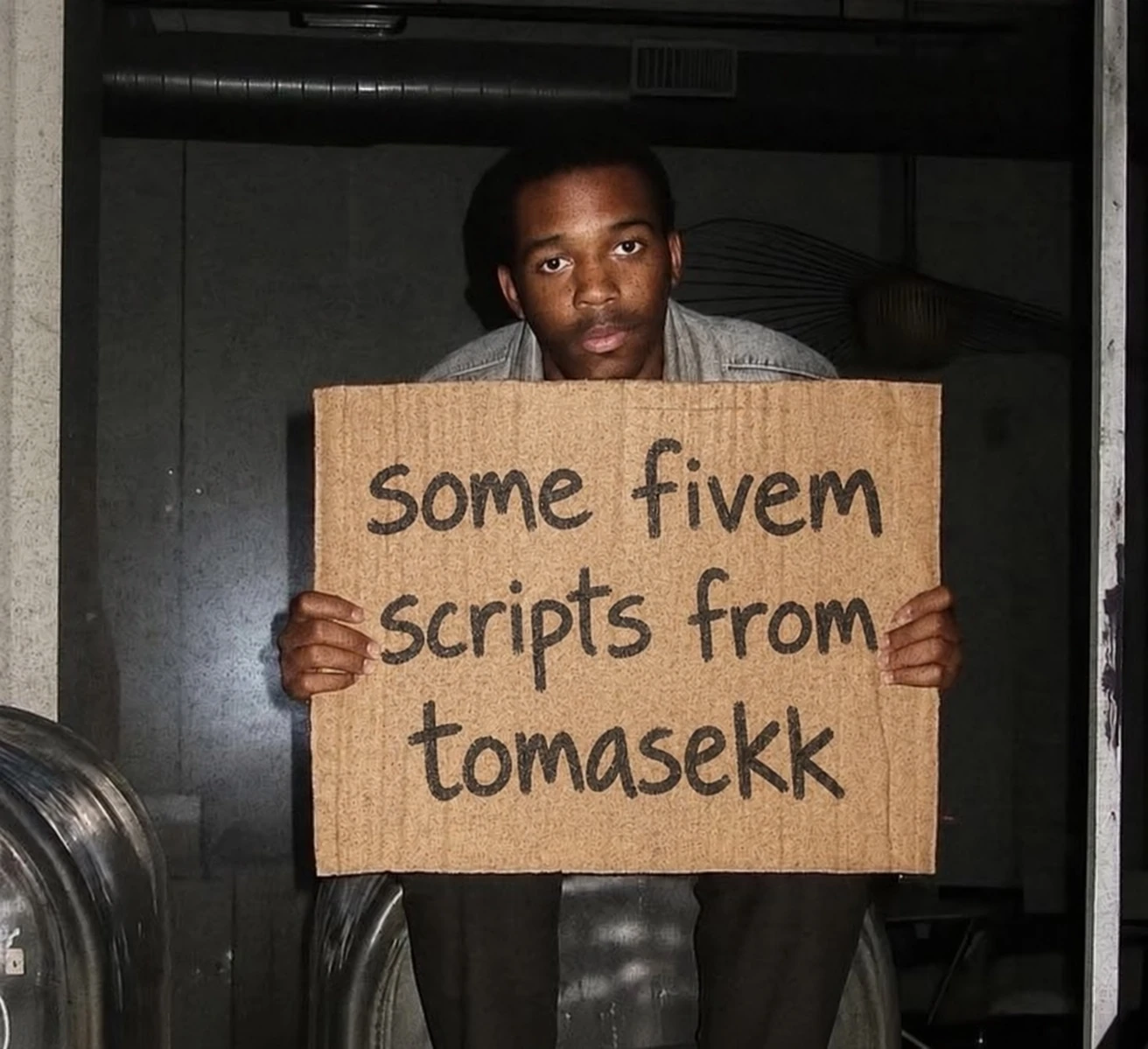 A man holding a sign reading some fivem scripts from tomasekk